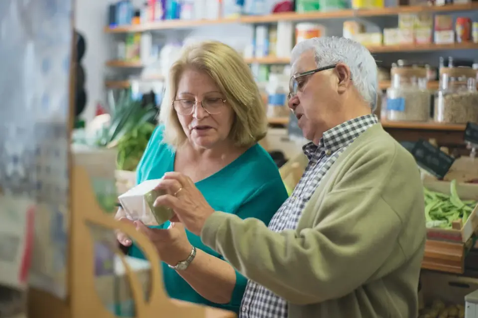 A veterinarian and dog owner reviewing a dog food ingredient label together