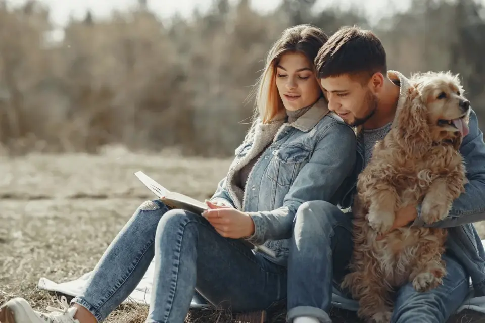 A veterinarian and dog owner reviewing a supplement label together
