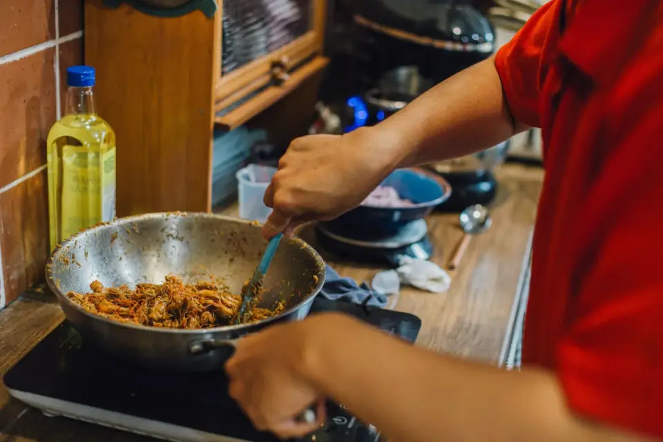 Dog owner preparing a meal