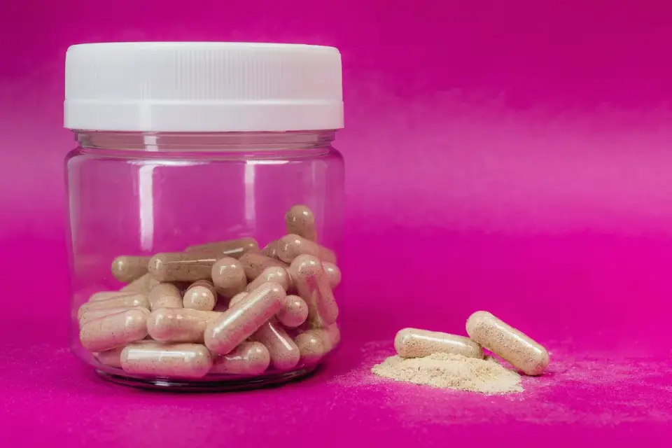 Hip and joint supplement chews next to their bottle on a kitchen counter