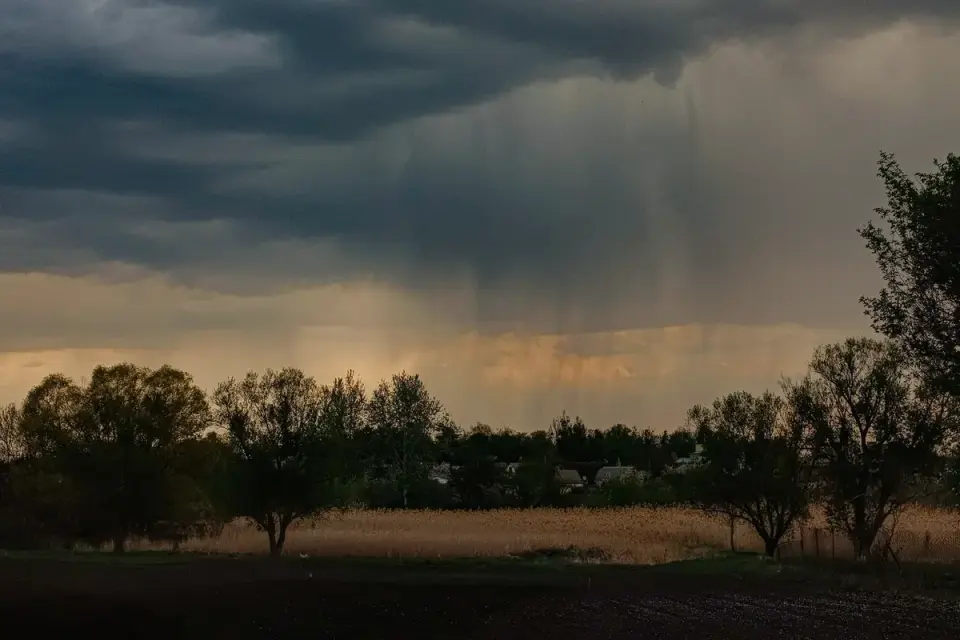 Storm clouds gathering over a backyard as a pressure front approaches